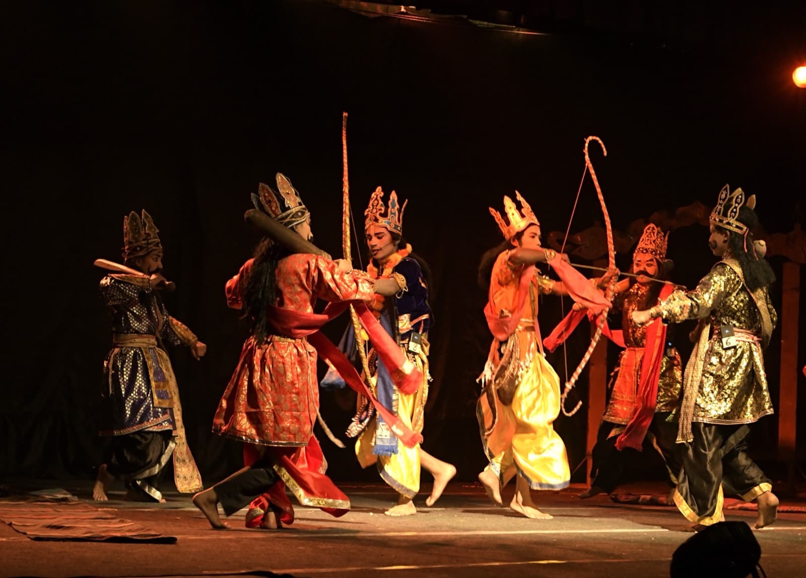 Students in theatrical costume on stage